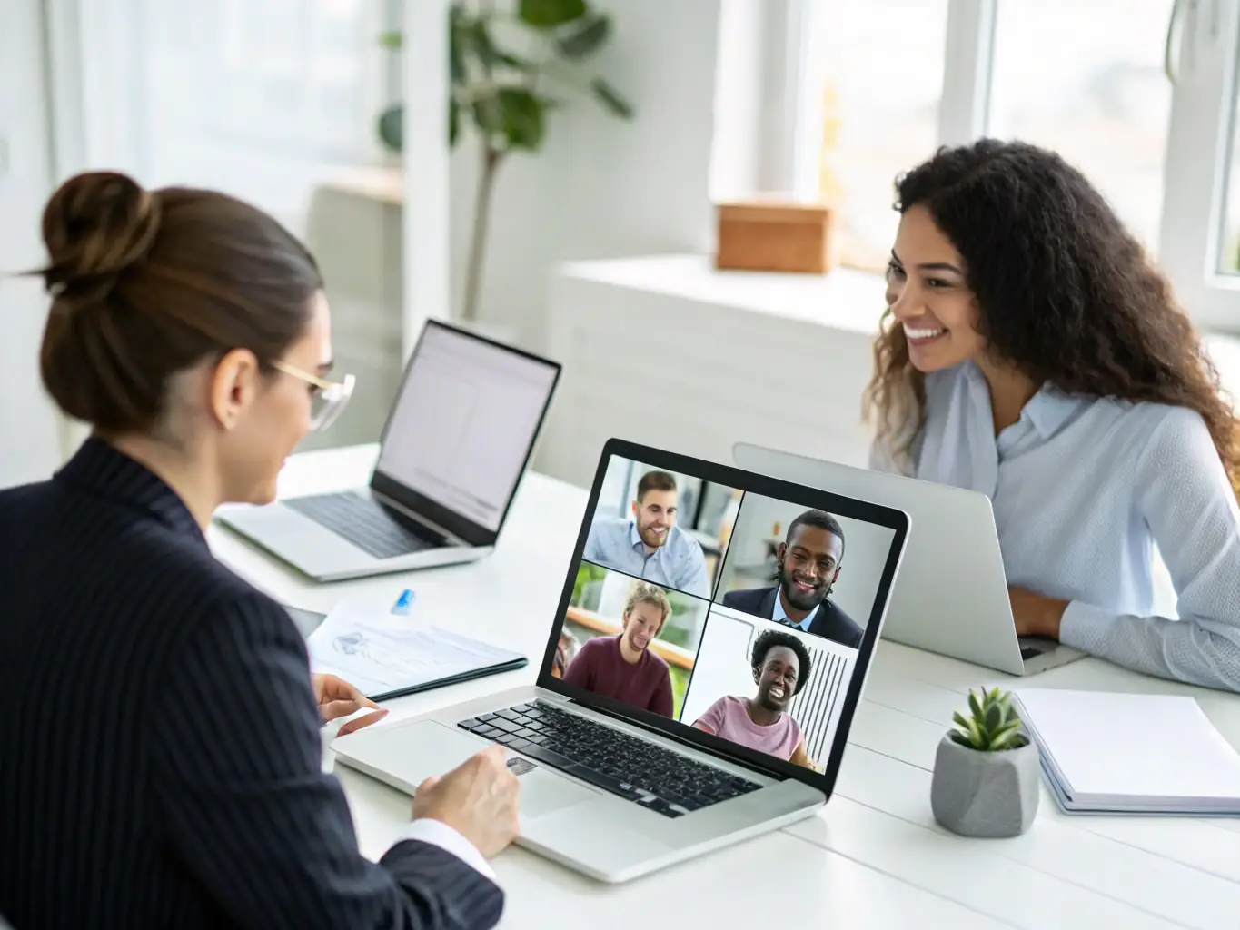 A support team on a video call with international clients, Canadian technology visuals in the background, showcasing Paschstel’s commitment to global partner support and ongoing assistance.